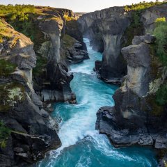 Abisko river canyon with turquoise water running between dark rock walls