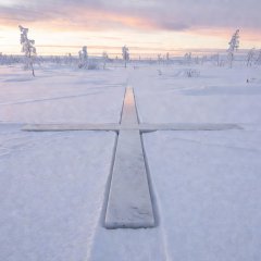 Arctic Circle line marker on the ground at Napapiiri near Rovaniemi