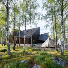 Exterior of the Siida Sámi museum and nature centre in Inari beside birch trees